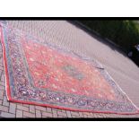 A large Middle Eastern style carpet - 400cm x 290c