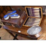 A vintage case with divisions, four items of guill