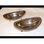 A pair of 16cm pierced silver bonbon dishes