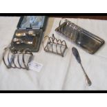 A silver toast rack etc.