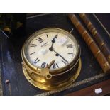 A 20cm diameter antique brass ships bulkhead clock