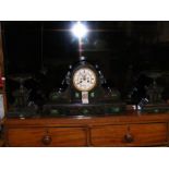 A Victorian slate and green marble mantel clock wi