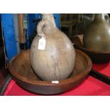 A large hand carved wooden bowl together with a Rh