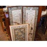 A pair of oriental embroideries and one other