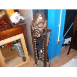 A CD rack in the shape of a carved African figure