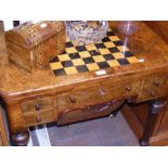 A Victorian walnut fold over games table with four