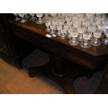 A Victorian rosewood fold-over tea table on centre