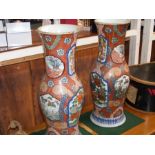 A pair of antique Oriental vases with floral decor