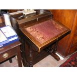 A Davenport style desk with fitted top