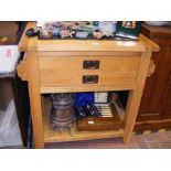 A modern kitchen island with marble insert and dra