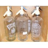 A collection of Isle of Wight soda siphons, includ