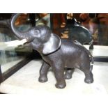 A Japanese bronze elephant ornament with signature