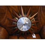 A Metamec sunburst wall clock