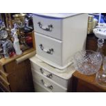 A two drawer white bedside cabinet, together with