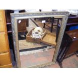 A decorative gilt wall mirror