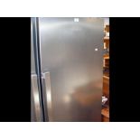 A Grundig upright refrigerator in silvered finish