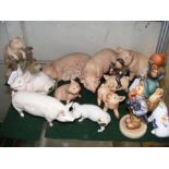 A collection of assorted ceramic pigs, including B