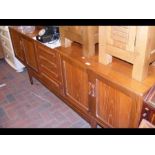 A G Plan style sideboard with four centre drawers