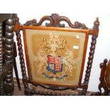 A Victorian fire screen with tapestry panel