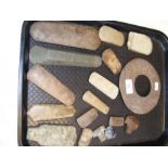 An assortment of antiquarian stone axe heads, etc.