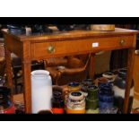 An antique side table with single drawer