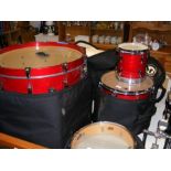 A Pearl Masters drum kit with cases, comprising ba