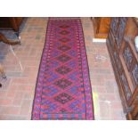 An antique runner with geometric border - 256cm x