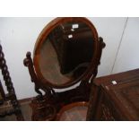A Victorian toilet mirror with compartments below
