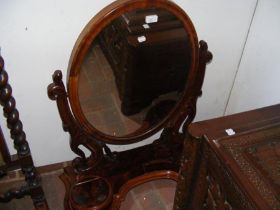 A Victorian toilet mirror with compartments below