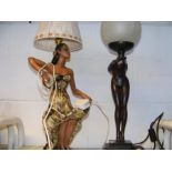A vintage style table lamp together with one other