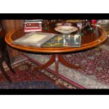 A large reproduction circular dining table with cr