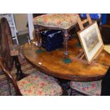 A Victorian oval dining table with a set of four V