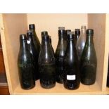 Thirteen vintage Isle of Wight glass bottles inclu