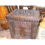 A Victorian carved oak storage chest