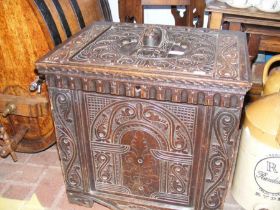 A Victorian carved oak storage chest