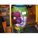 A large Moorcroft pottery 'Clematis' pattern vase