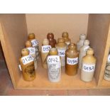 Twelve vintage Isle of Wight stoneware bottles inc