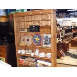 A large open pine bookcase