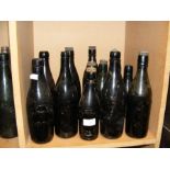 Fourteen vintage Isle of Wight glass bottles inclu