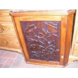 A walnut cabinet with a walnut corner cabinet with