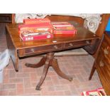 A Regency sofa table with two drawers to the apron
