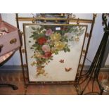 A Victorian brass fire screen