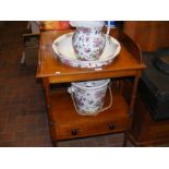 An antique washstand with transfer printed jug and