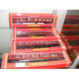 Five boxed Hornby coaches in maroon livery - R223