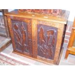 An interesting carved Aesthetic Movement cabinet w