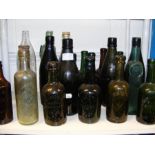 A collection of Isle of Wight bottles, mostly gree