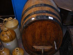 A vintage metal bound barrel on stand - 65cms long
