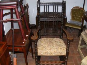 A Victorian carved rocking chair