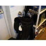 A set of gentleman's golf clubs in bag, together w