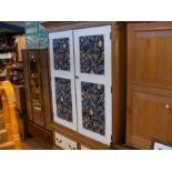 A modern pine wardrobe decorated with fabric panel